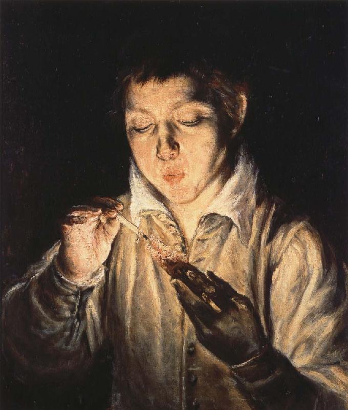  A Boy blowing on an Ember to light a candle